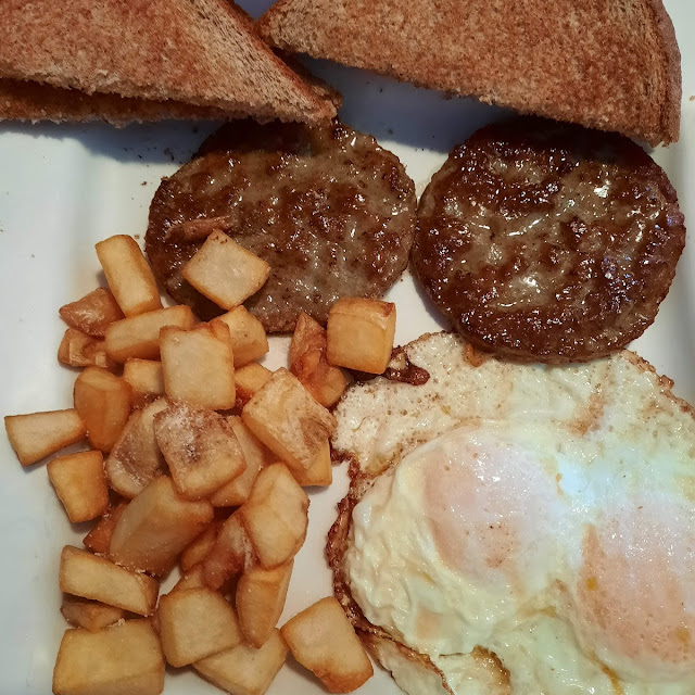 Eggs, sausage, toast, and breakfast potatoes